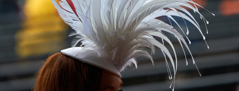 Woman at the races in a fancy hat