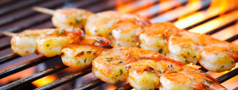 Prawn skewers on a grill 