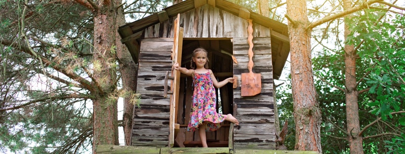 Little girl in a treehouse