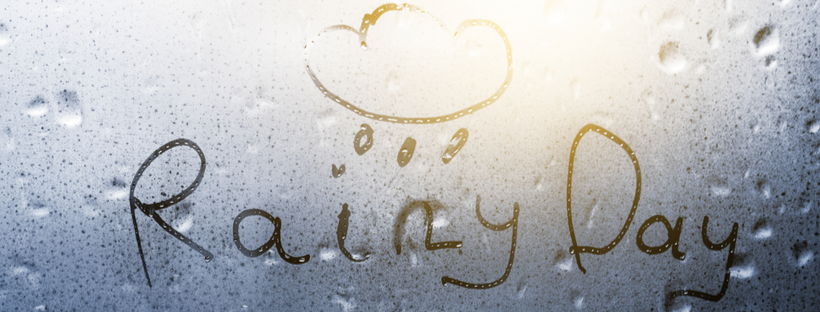 Rainy day written on glass window