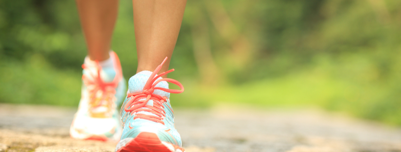 Woman walking with sneakers on