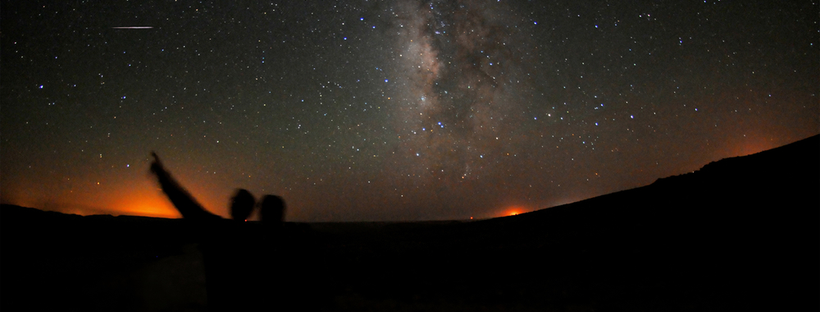 People pointing at the stars