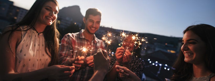 Friends celebrating with sparklers