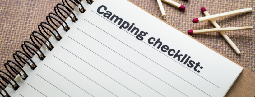 Camping checklist on spiral notepad